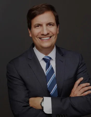 Doctor Peter Bongiorno in suit arms crossed